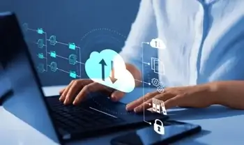 A man using cloud computing on a laptop